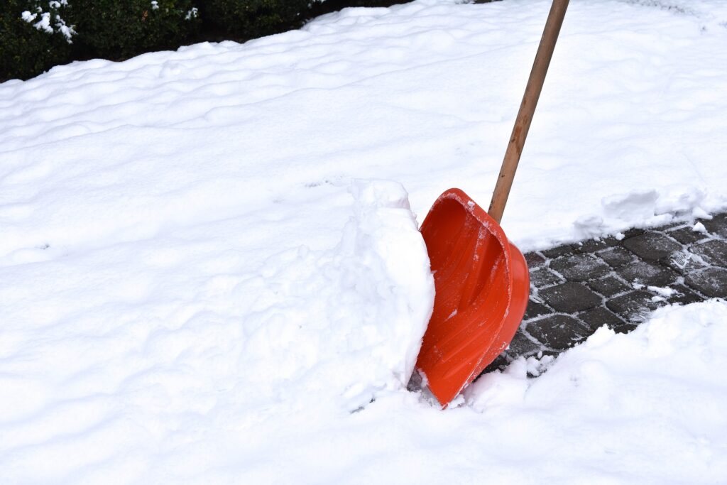back pain shoveling snow